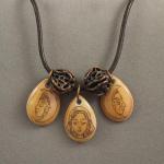 Triple Goddess and bronze pods on leather Cord